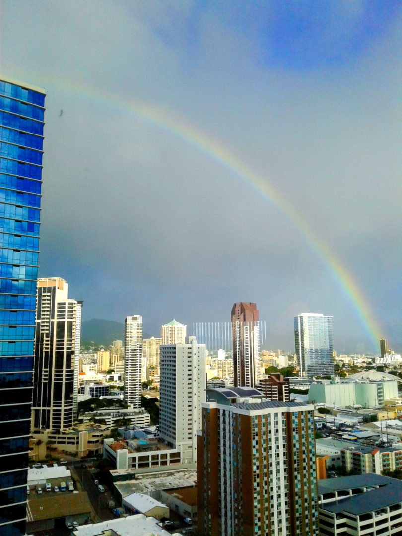 A rainbow over the city of honolulu, hawaii.