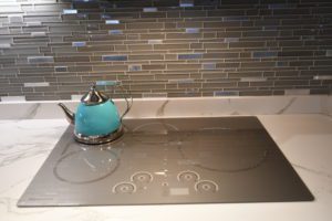 A teapot sitting on top of an electric stove.