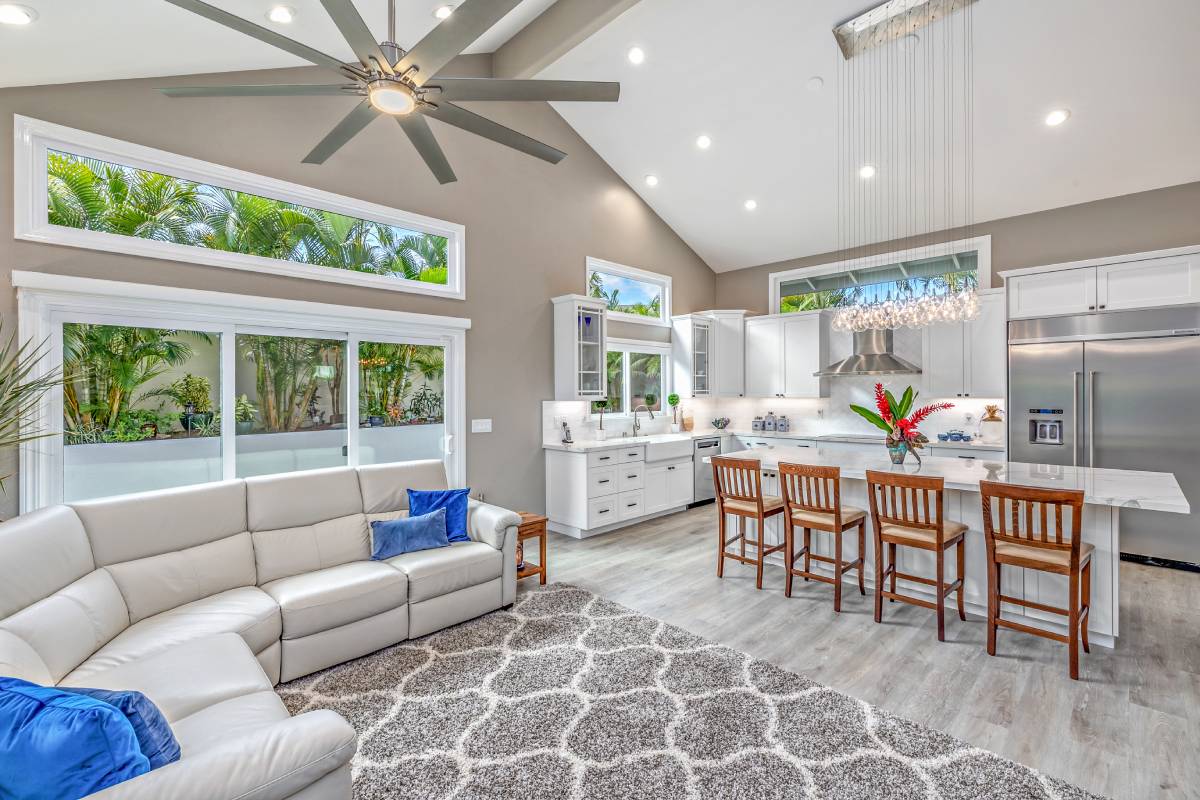 A living room with a couch and chairs in it