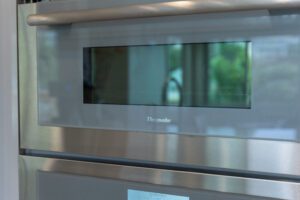 A close up of the oven door with a window