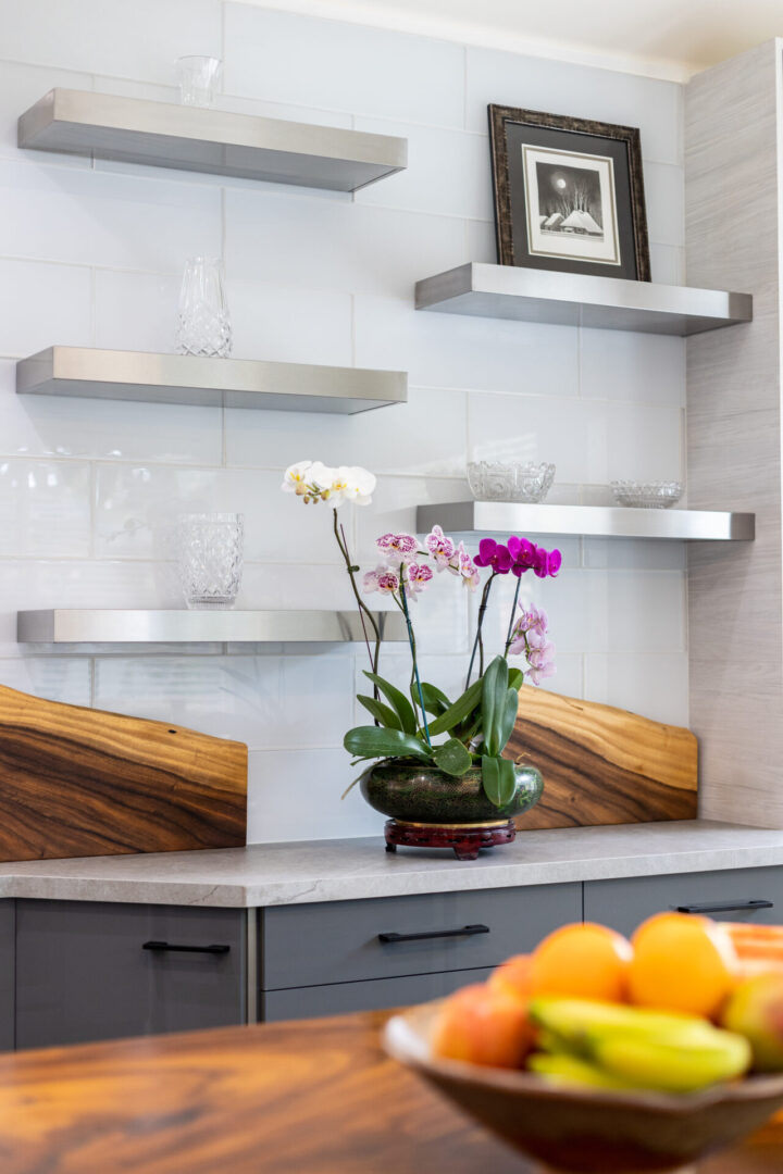 A kitchen counter with some flowers in it