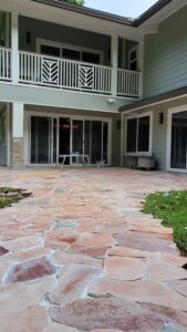 A patio with a table and chairs in it
