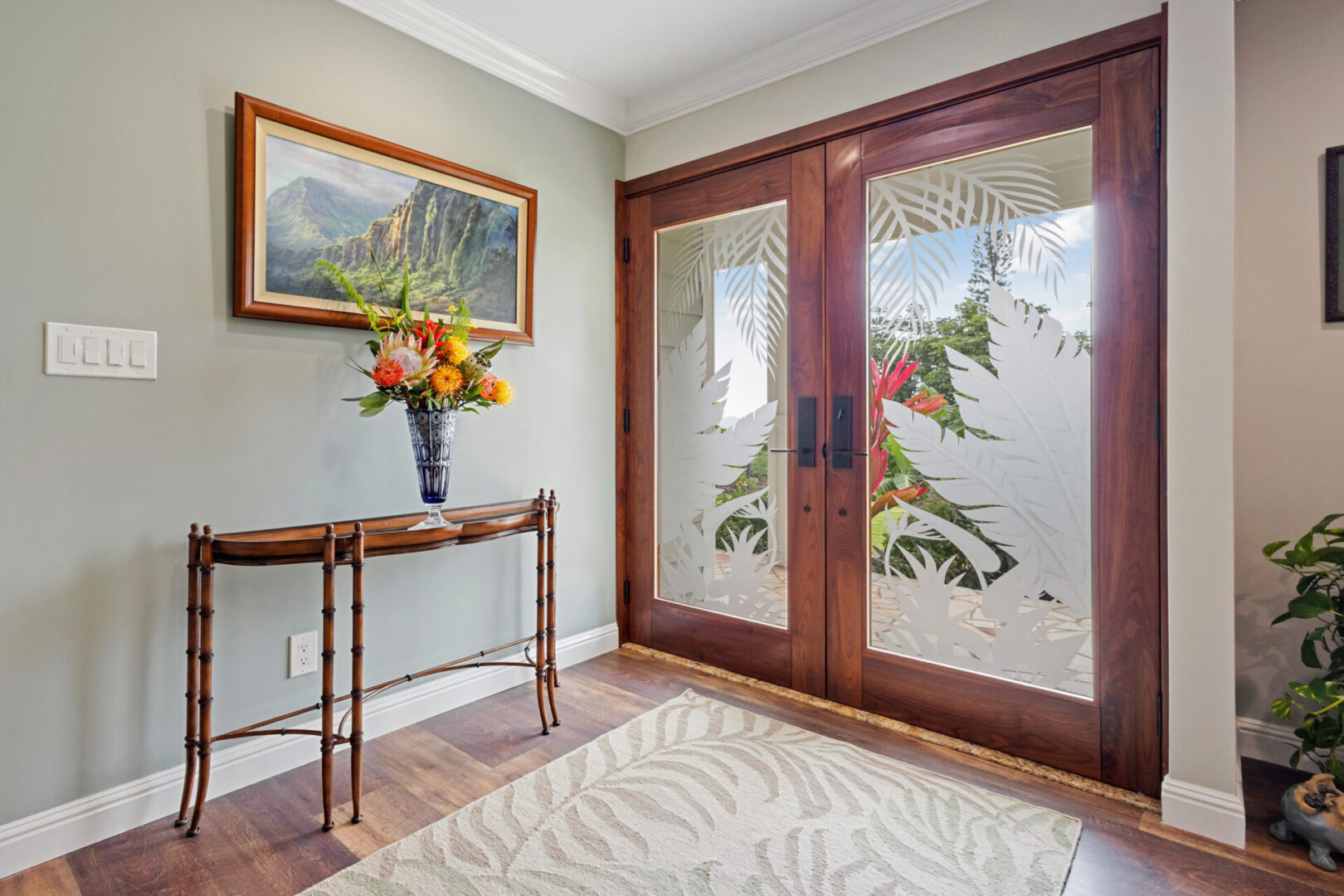 A picture of a tropical scene in the doorway.